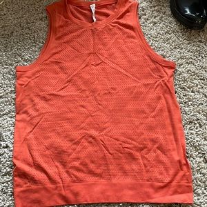 Lululemon orange swiftly muscle tank. Good condition.